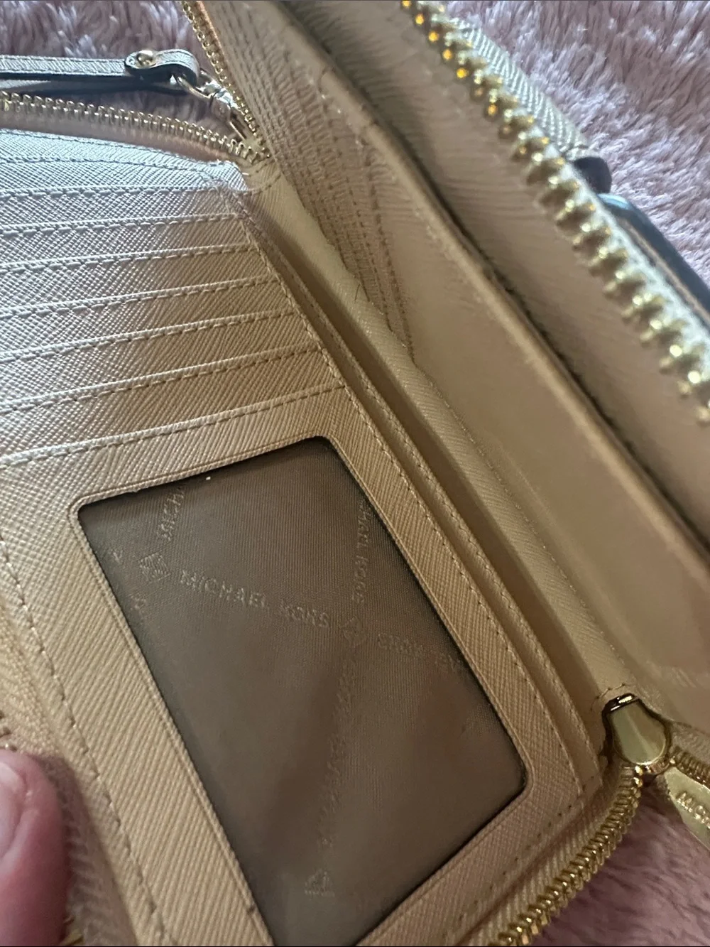MK wristlet in light tan/ Beige